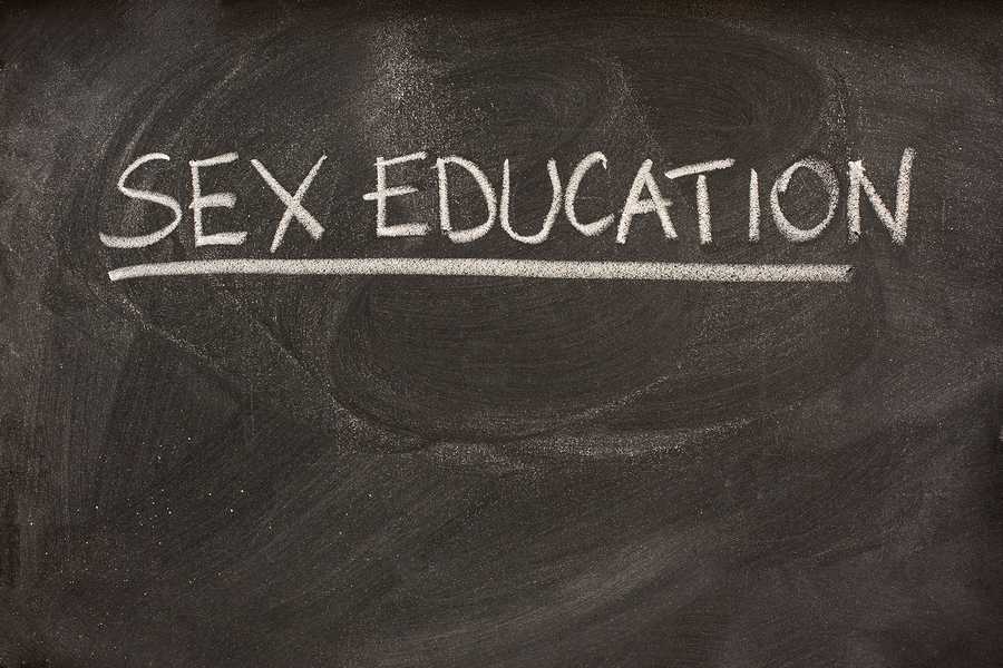 sex education handwritten with white chalk as a class or lecture topic on blackboard