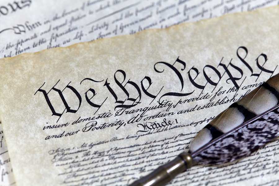 US Constitution Declaration of Independence Bill of Rights with a Quill pen and shallow depth of field