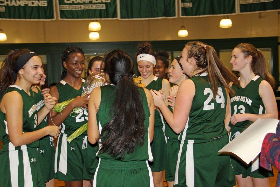 At her last home game, Amy Nwachukwu ’18 celebrates with her team during halftime. Photo by David Cutler 02.