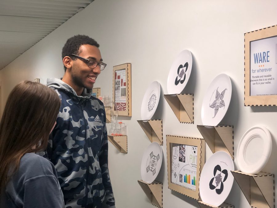 Alphonse Houndegla ’21 and Molly McHugh ’21 observing problem solving through design’s projects. Photo By Sita Alomran ’19. 