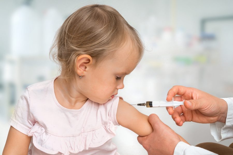Pediatrician+doctor+is+injecting+vaccine+to+shoulder+of+baby+-+vaccination+concept
