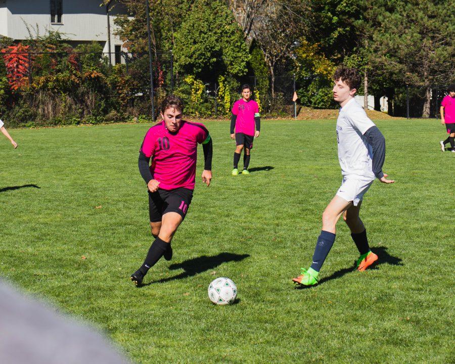 Olivier Khorasani ’20 defends as a BCA player attempts to make a goal.