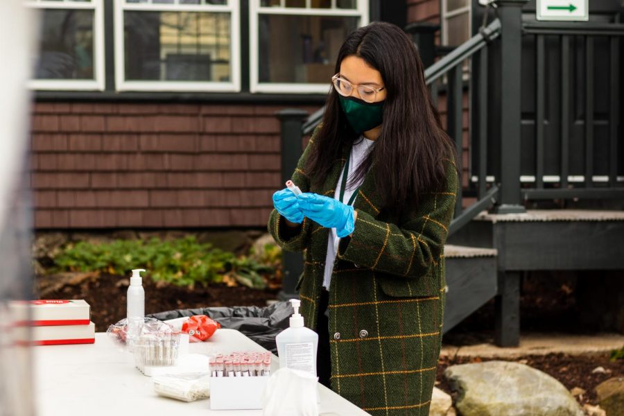 Nurse Vicki Trinh collects PCR test samples during the community testing day.