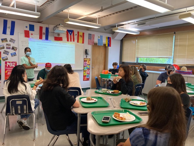 Students participate in a lunch meeting.