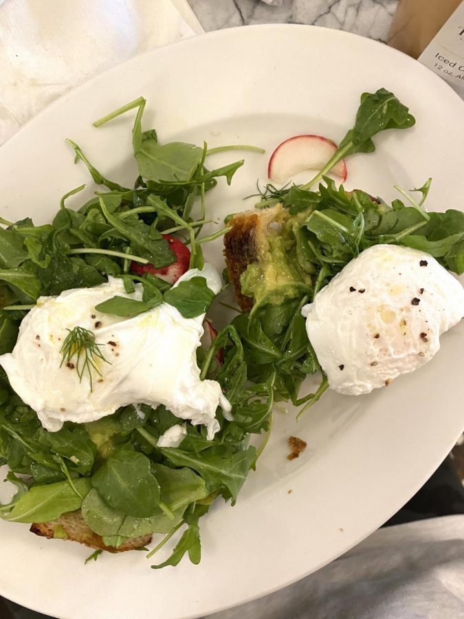 Tattes Avacado Tartine, which features avocado, baby arugula, dill, and radish topped with poached eggs on housemade sourdough, according to the cafes menu.