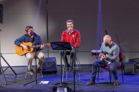 Ted Barker-Hook, Donald Reese, and Bill Jacob perform Slip Slidin Away by Paul Simon.