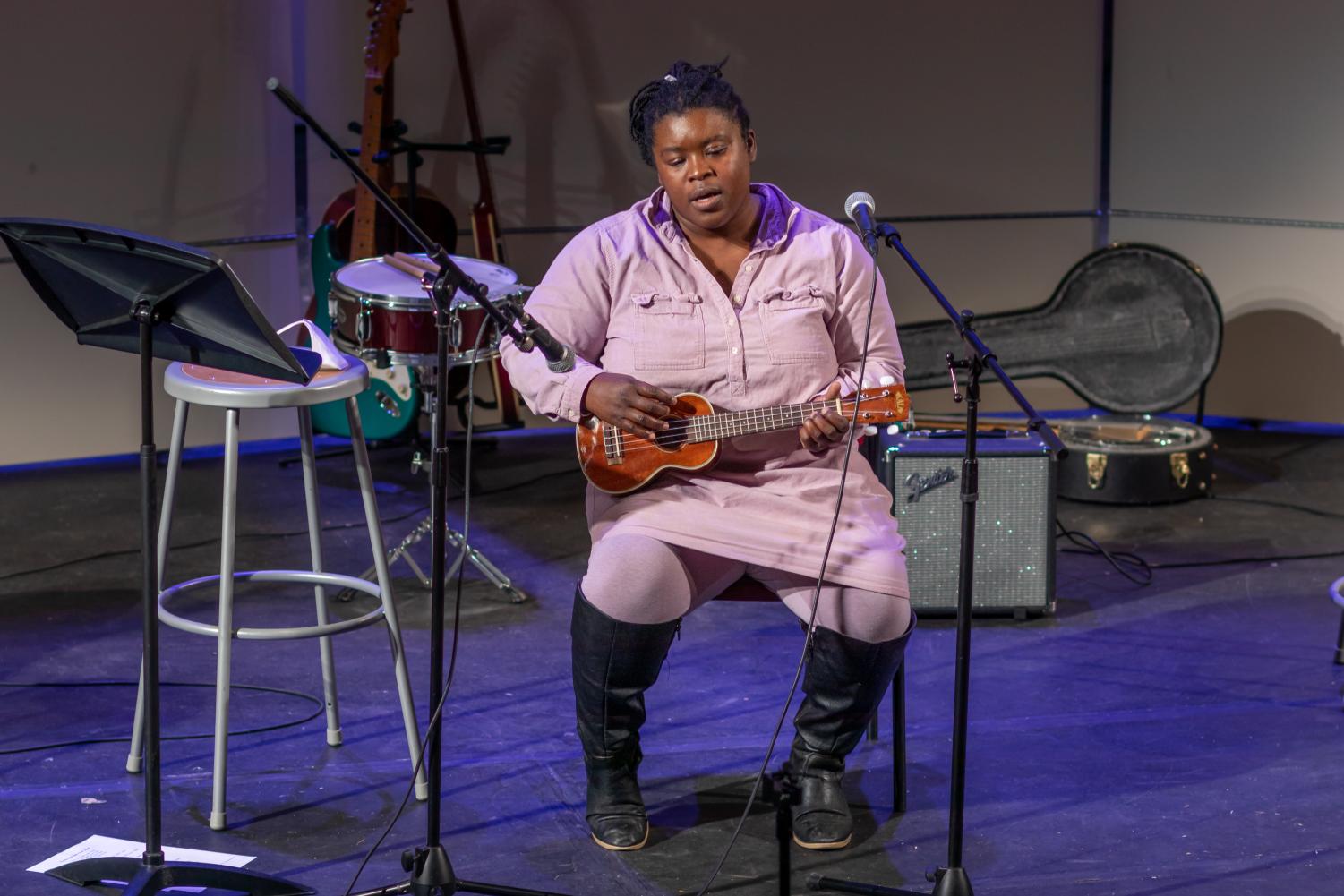 Librarian Elyse Seltzer plays a song on Ukelele during a Coffee House.