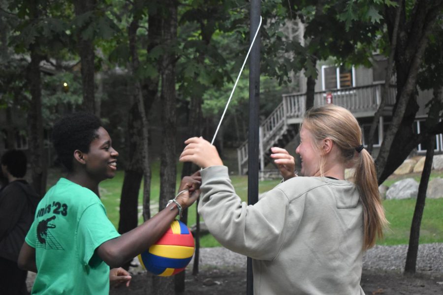 Ugo Adiele 23 and Alison Rimas 23 play tetherball.