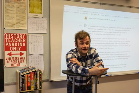 History and Journalism Teacher David Cutler demonstrates how AI can write essays. Photo illustration by Edan Zinn.