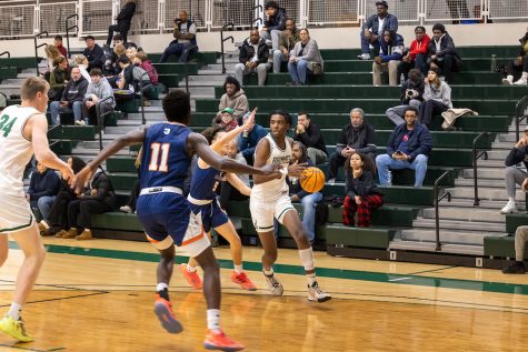 Bryce Ruglass Dortch 24 drives to the hoop.