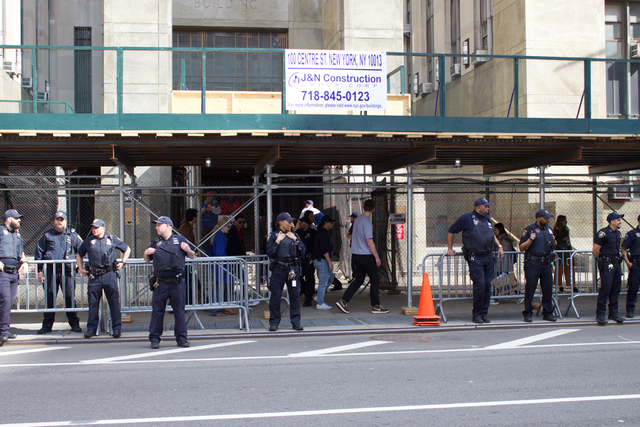 Police personnel stand outside the entrance to the New York Criminal Court during the arraignment of Former President Donald Trump. Photo Courtesy of Wikimedia Commons. 