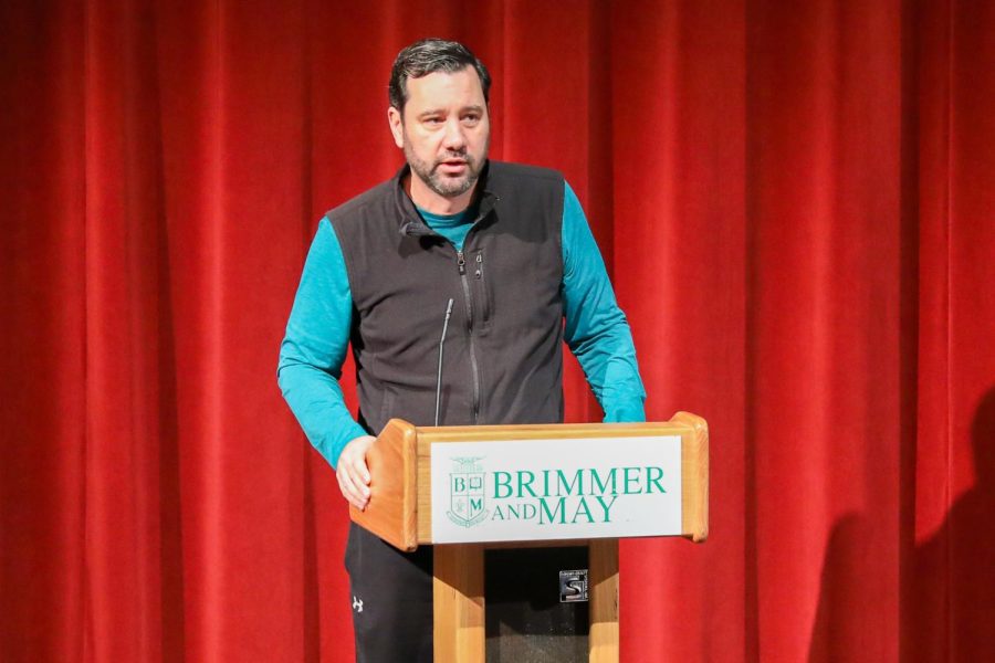 Athletic Director Brett Kelly leads the fall commitment ceremony for students.