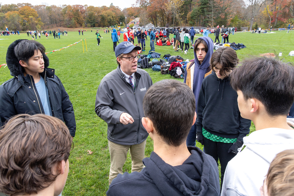 Coach+Barker-Hook+talks+strategy+with+his+runners.