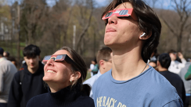 Armed+with+special+sunglasse%2C+students+and+faculty+gazed+in+awe+of+todays+solar+eclipse%2C+witnessing+the+celestial+event+together.