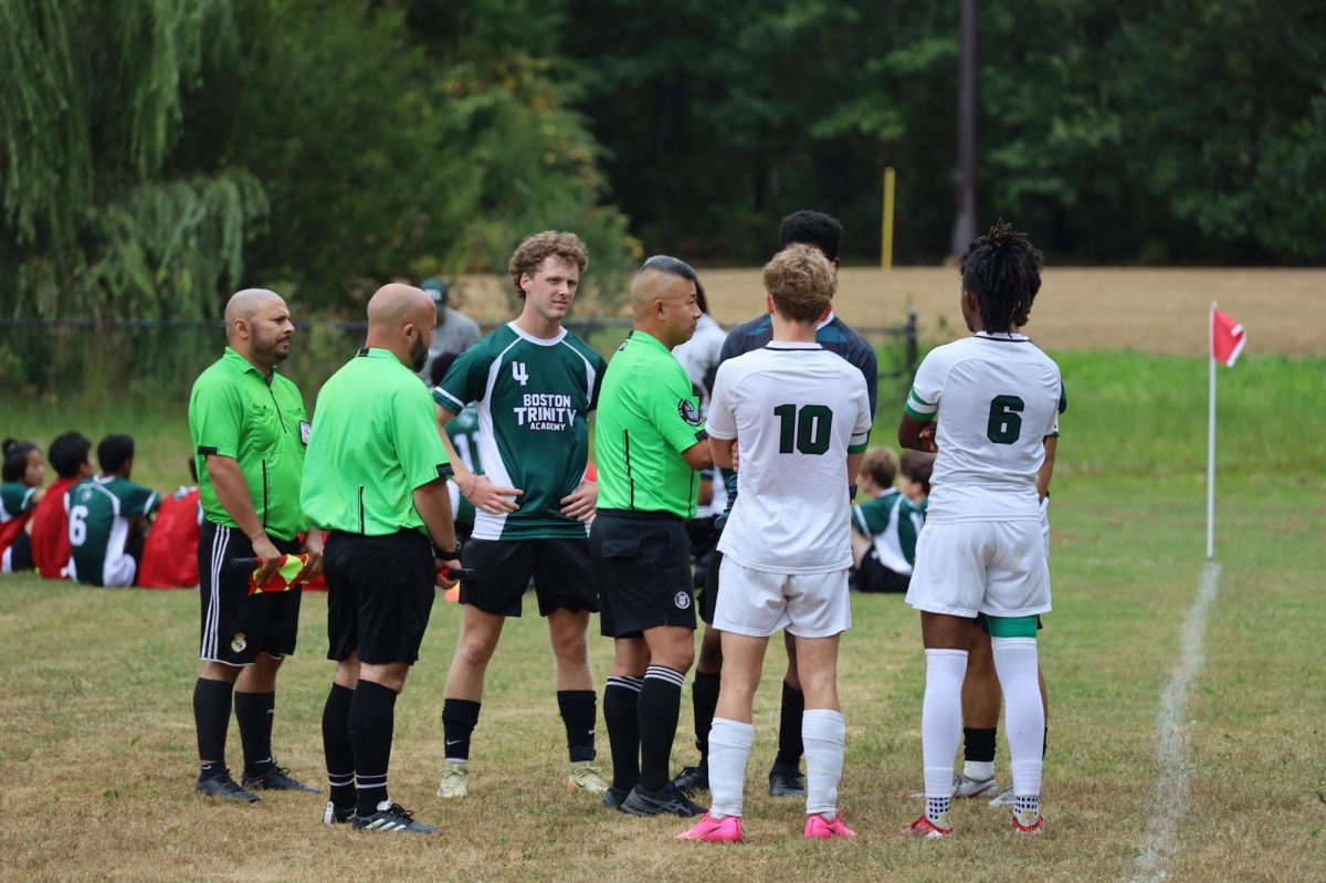 Team Captains Lucas Williams 25' and Christoph Kasper 25' congregate with BTA and refs before match.