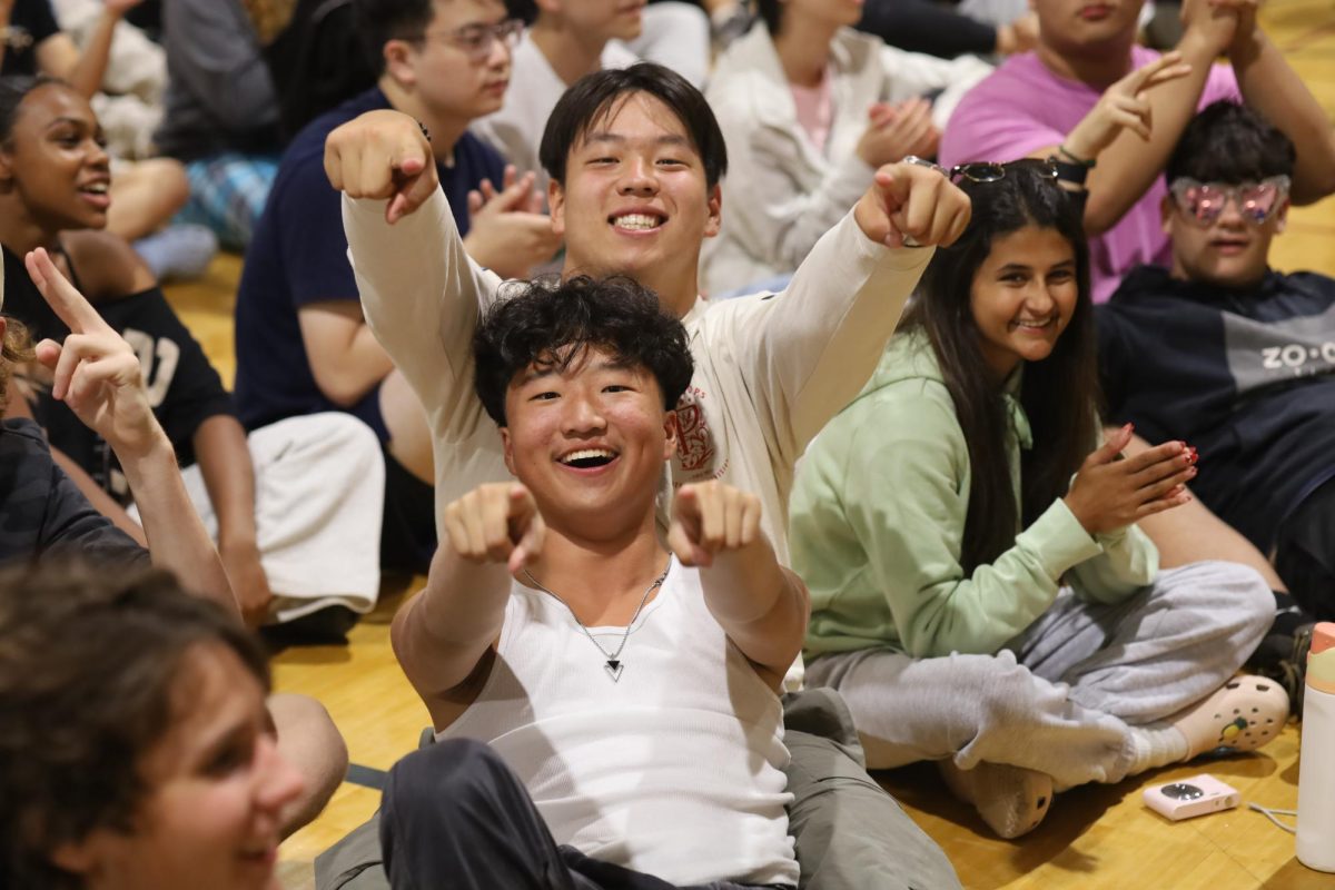 Seniors Huck Jennings and Lincoln Jiang show enthusiasm during Thursday night's talent show.