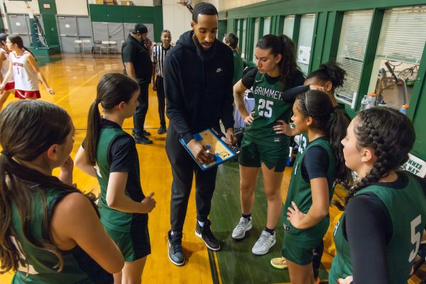 Coach Sims instructs his team.