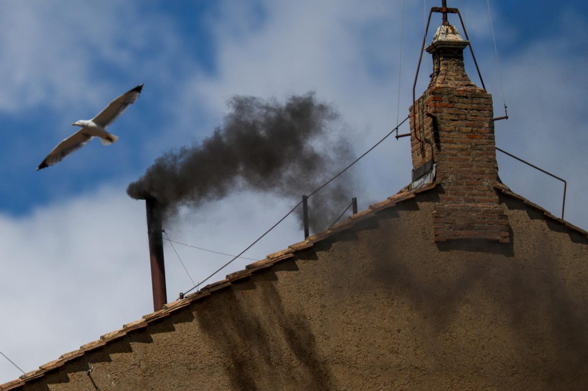 Black smoke rises from the chimney on the Sistine Chapel, indicating no decision has been made to elect a new pope, at the Vatican, May 8, 2025. REUTERS/Hannah McKay
