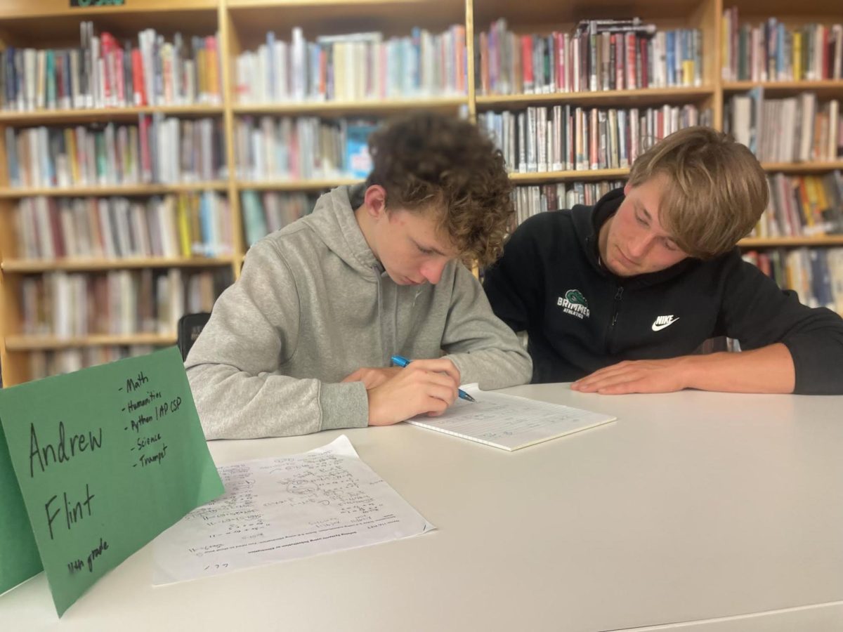 Andrew Flint '26 tutors Henry Morrison '30 in math. 