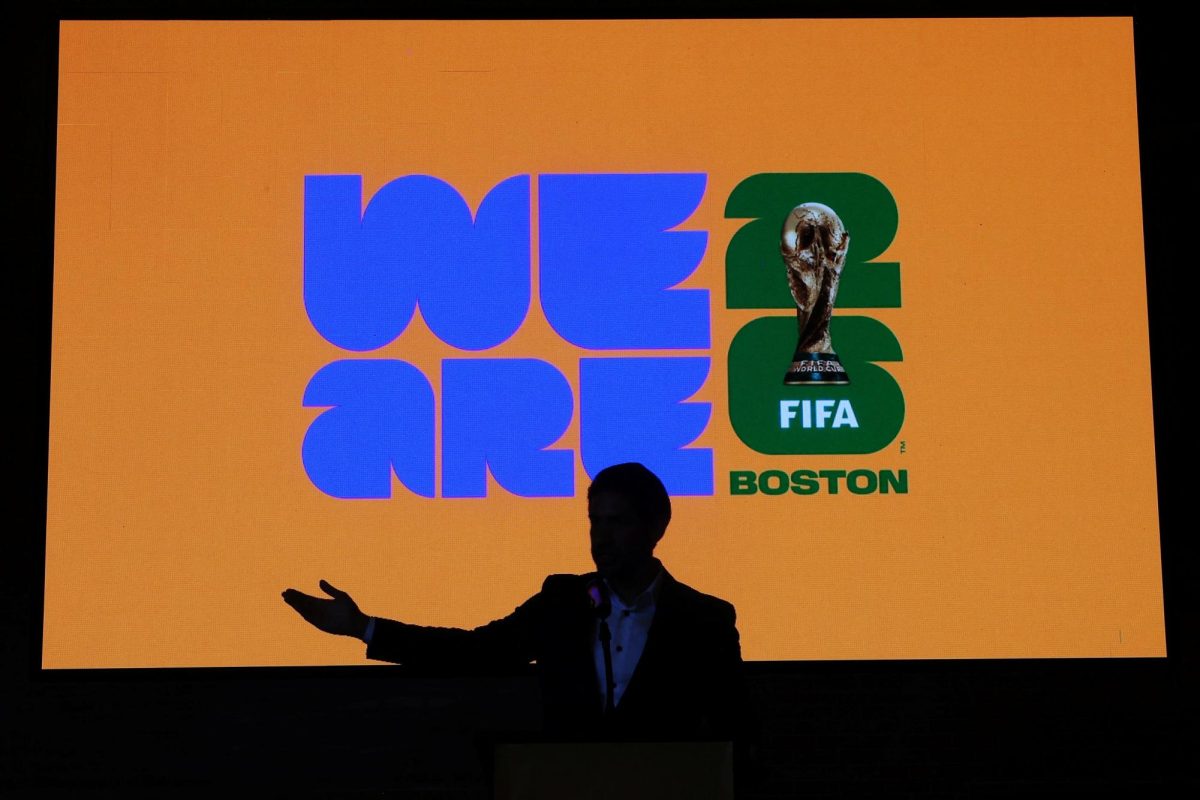 TV sports reporter Jesus Quinonez speaks in front of the newly unveiled Boston FIFA World Cup 2026 logo in Boston, Massachusetts, U.S., May 18, 2023.     REUTERS/Brian Snyder