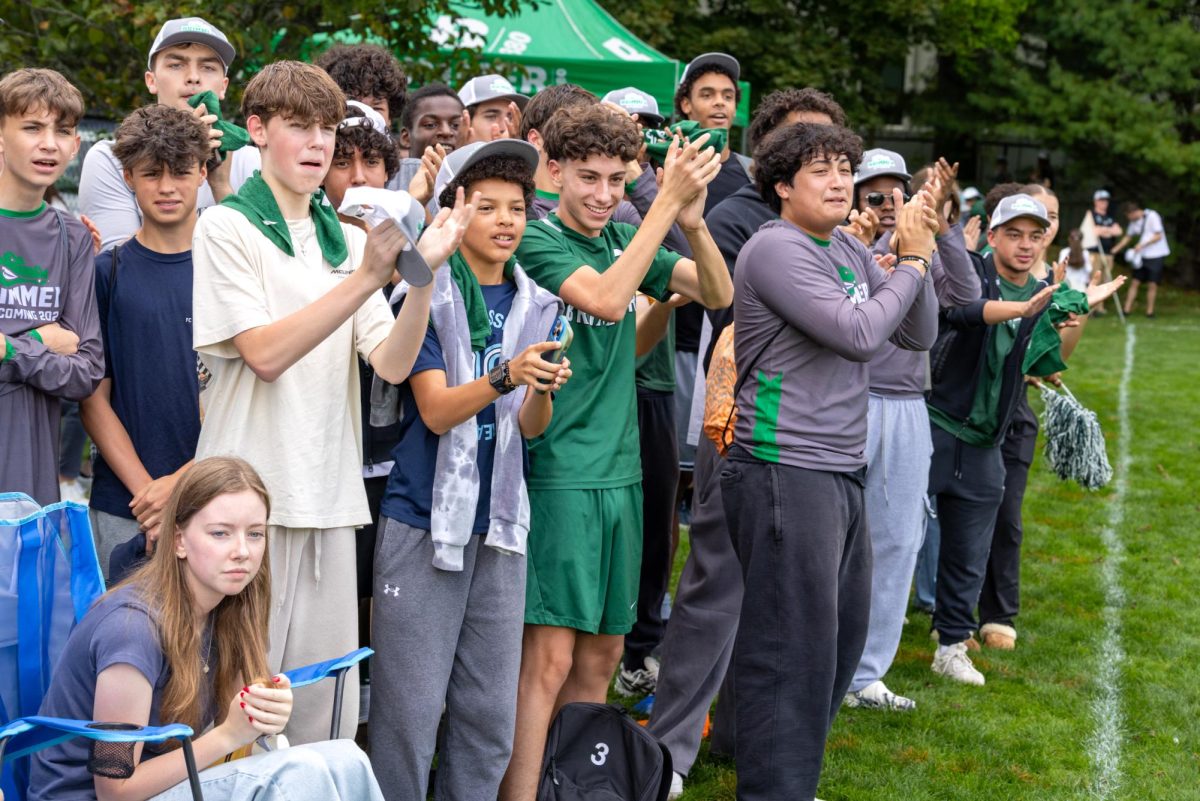 Fans cheer during the girls' game against Boston Trinity Academy. 