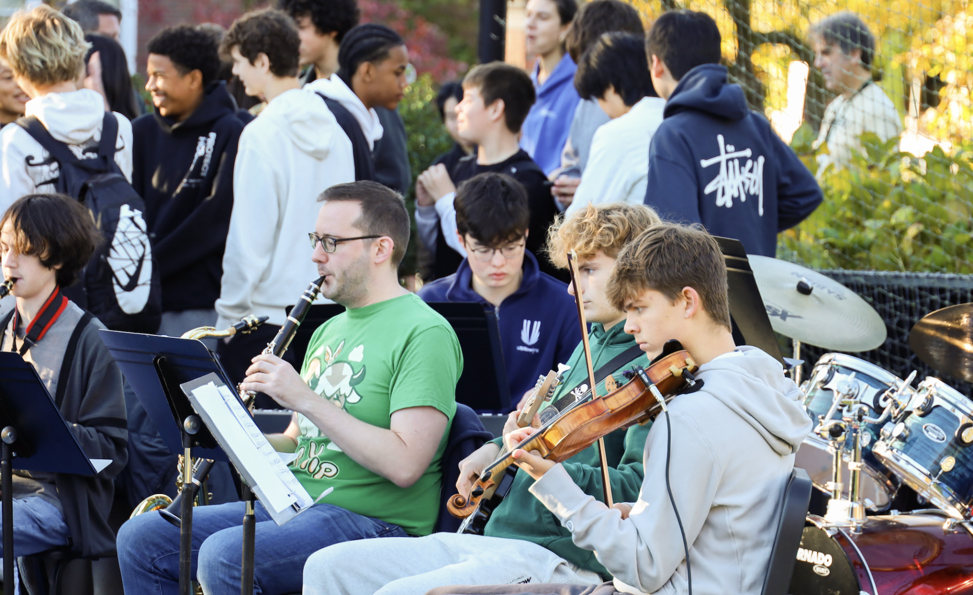 Lower, Middle, and Upper School students came together on the field today for Harvest Fest, enjoying an hour of fun with live music from Gator Scales, cider donuts, drinks, pumpkin rolling, limbo, and plenty of time to relax and hang out.