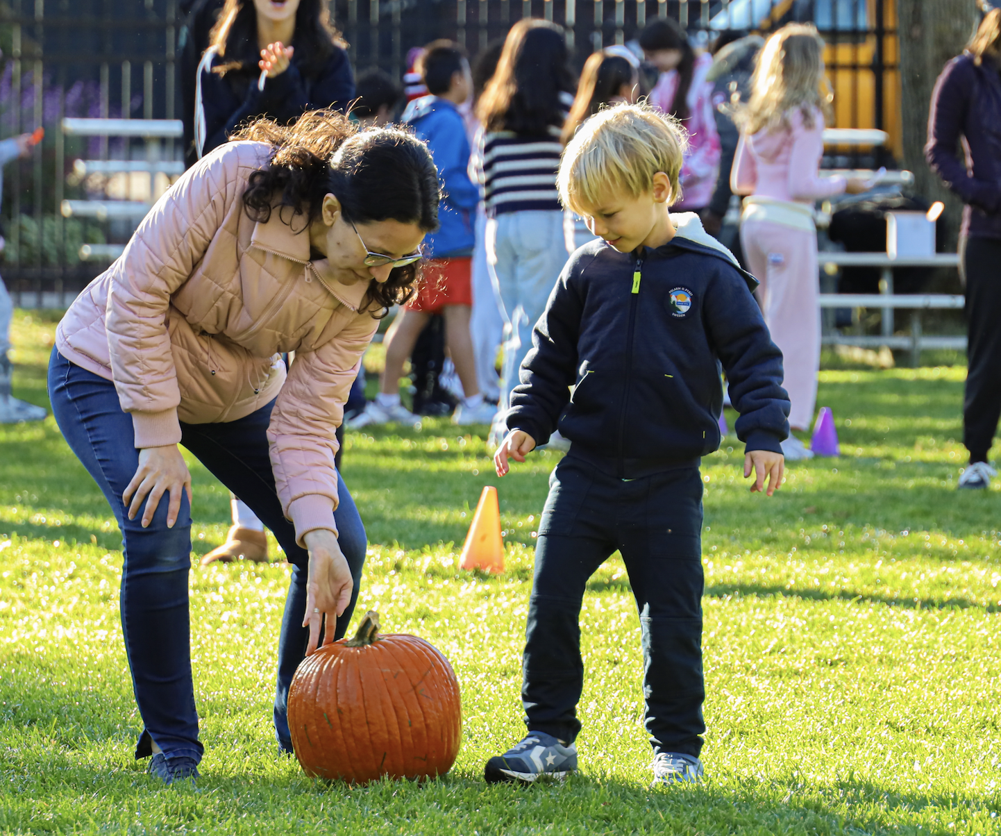 Lower, Middle, and Upper School students came together on the field today for Harvest Fest, enjoying an hour of fun with live music from Gator Scales, cider donuts, drinks, pumpkin rolling, limbo, and plenty of time to relax and hang out.