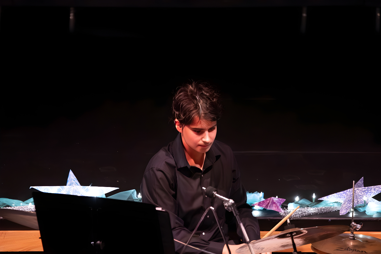 An hour of music community spirit filled the packed theater Thursday evening as students from across divisions showcased their talents at the annual Winter Concert.