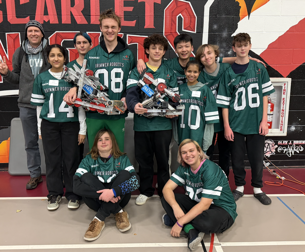 Leonard Wholey poses with his robotics team after the competition. 