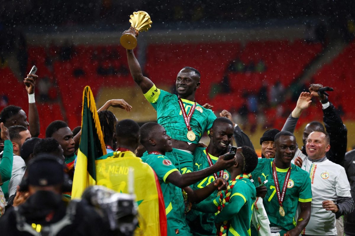 Soccer Football - CAF Africa Cup of Nations - Morocco 2025 - Final - Senegal v Morocco - Prince Moulay Abdellah Stadium, Rabat, Morocco - January 18, 2026 Senegal's Sadio Mane lifts the trophy with teammates as they celebrate after winning the Africa Cup of Nations REUTERS/Siphiwe Sibeko