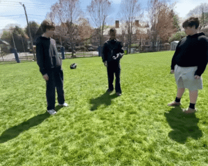 Students play hacky sack during a free period. 